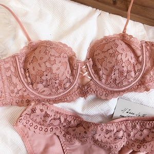 Detail of dusty rose floral lace lingerie set with underwire bra and strappy cross detail