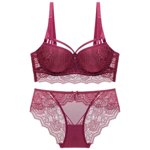 Flat lay of wine red lace lingerie set featuring a wired bra and matching panties