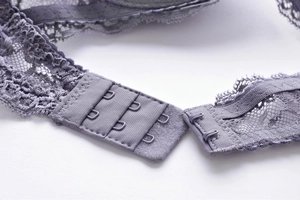 Close-up of the lace back closure with three-row two-button hook-and-eye details