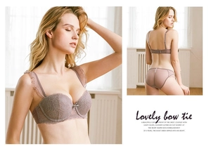 Detailed view of dusty purple lace bra set with ruffle trim and delicate pearl bow