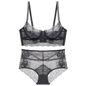 Detailed view of sheer black floral lace lingerie set with breathable mesh texture