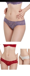Close-up of elegant floral lace details and decorative bows on women's low-waist panties