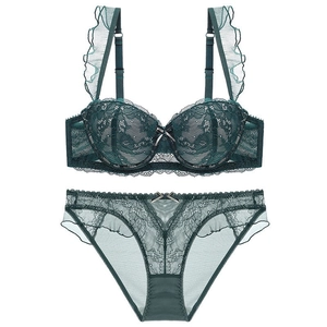 Deep green lace lingerie set with ruffled straps and push-up bra on white background