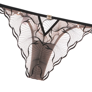Detail of black lace embroidery thong with fan-shaped mesh and gold ring metal buckle