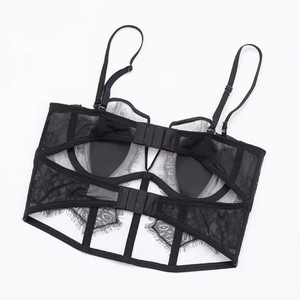 Detailed view of the hook-and-eye closure and eyelash lace on this black corset bra