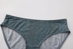 Close-up of low-rise denim style panties showing fine fabric texture and stitching