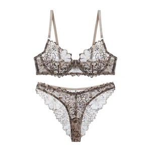 Detailed view of sheer champagne lace lingerie set with mesh floral patterns