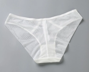 Detailed close-up of white breathable mesh fabric and reinforced stitching on panties