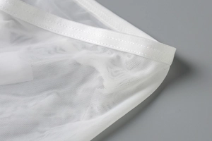 Close-up of white semi-transparent mesh fabric with precise stitching and breathable texture