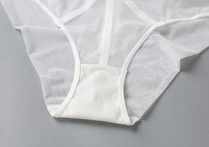 Close-up of white breathable mesh panties showing pure cotton gusset and flat seams