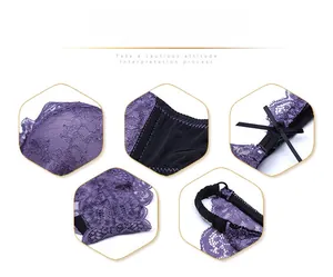 Close-up of purple lace embroidery with black bow detail and professional stitching