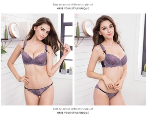 Close-up detail of sheer purple floral lace bra with black bow accents and matching panties