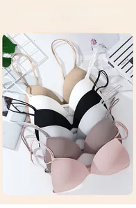 Flat lay of seamless wire-free triangle bras in multiple colors with thin straps
