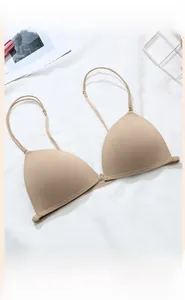 Front-closure beige wireless bra with seamless cups and adjustable spaghetti straps