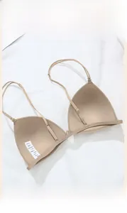 Detailed view of beige front-closure triangle cup bra with adjustable thin straps