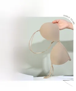Detail view of seamless beige triangle bralette showing smooth fabric and thin straps