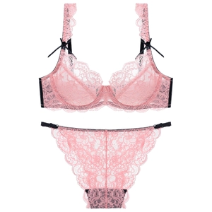 Pink lace lingerie set with sheer embroidery details and black bow accents for women