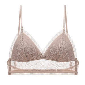 Detail of floral lace triangle cup bra with adjustable straps in beige skin tone