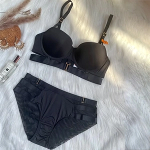 Elegant black seamless push-up lingerie set with front closure and strappy lace-up details