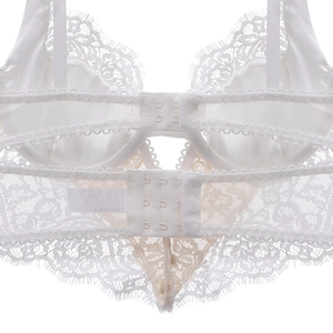 Close-up of white eyelash lace bra back with hook and eye closure and mesh details