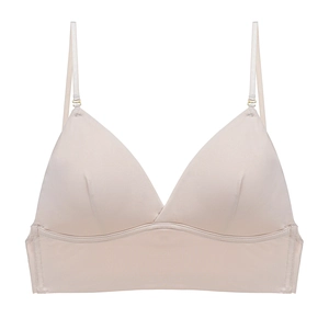 Detail of beige seamless satin bralette with thin straps and gold hardware adjustment