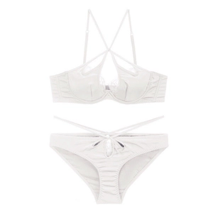 Detail of white satin and eyelash lace lingerie set with crisscross straps and underwire