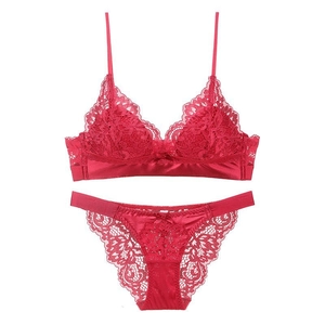 Red French lace bralette set with floral embroidery and silk satin panties on white background