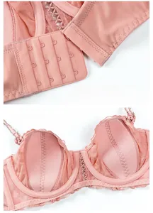 Detail of pink lace bra featuring a four-row back hook and anti-protrusion cups