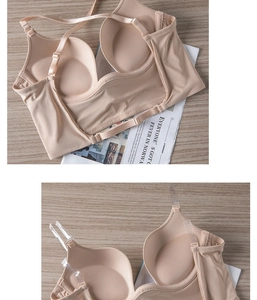 Detail view of seamless beige U-back bra with non-slip silicone strips and clear straps
