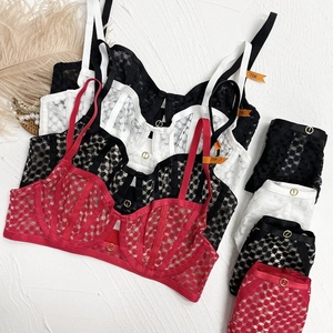 Lace bra set featuring sheer mesh, underwire support and decorative gold ring details