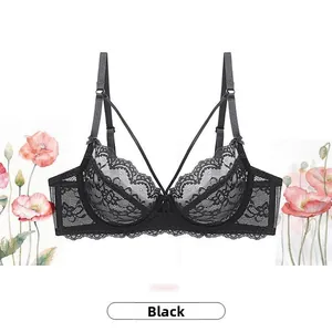Detail view of black lace bra with cross straps and scallop edges for a sleek look