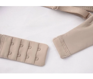 Detail view of seamless bra back closure with four-row two-button hooks and straps