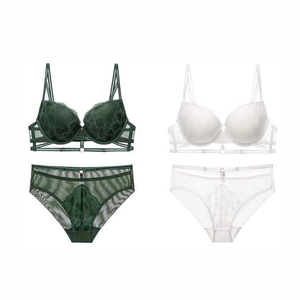 Detailed flat lay of French lace bra sets with scallop textures in green and white colors
