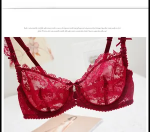 Close-up of wine red lace bra featuring intricate floral patterns and bow details