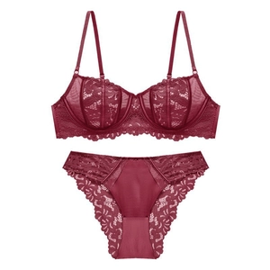 Deep red lace lingerie set with underwired floral bra and matching panties on white background