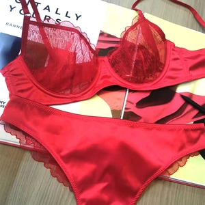 Elegant red lace lingerie set with underwire bra and matching satin floral panties