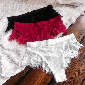 Detailed flat lay of high-waist eyelash lace panties in black, burgundy, and white colors