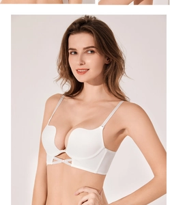 Detailed view of white seamless push-up bra with U-shape back and cross-strap design