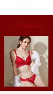 Detailed view of red eyelash lace lingerie set featuring delicate bow and floral patterns