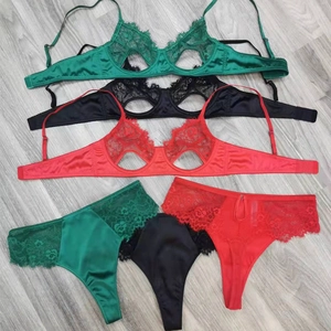 Detail showing red, black and green lace hollow cups with satin straps and waistbands