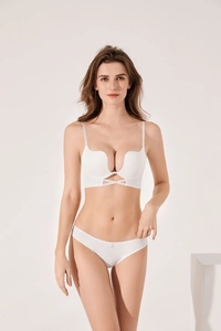 Detail view of white seamless push-up bra set featuring a deep U-neckline and smooth fabric