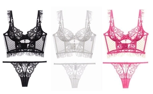 Detailed flat lay of French lace lingerie sets in black, white and rose pink colors