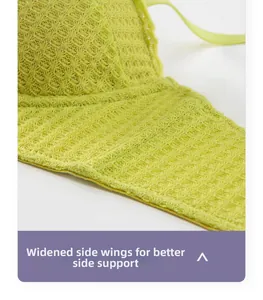 Detailed macro view of widened side wings on lace bra for breast smoothing support