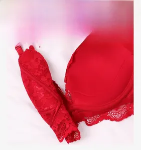 Detail of red floral lace bra showing anti-slip straps and high-quality texture