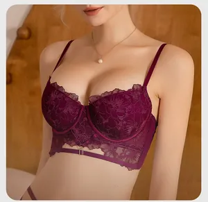 Detail of luxury deep purple embroidery lace bra with strappy cutout design