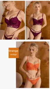 Detailed close-up of orange lace embroidery lingerie set with strap hollow design