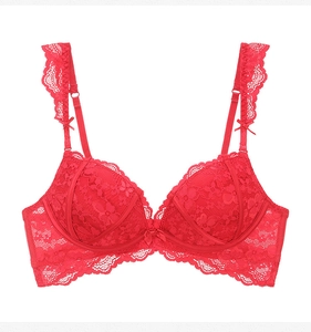 Detailed view of red floral lace bra featuring ruffled straps and delicate bow accents