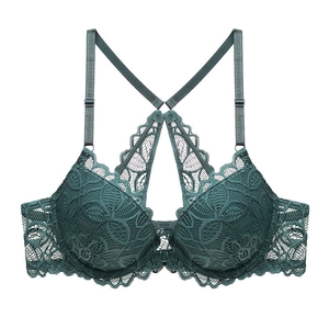 Reggiseno in pizzo verde scuro con chiusura frontale e spalline regolabili su bianco