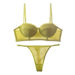 Lace lingerie set with green mesh bra and thong on white background