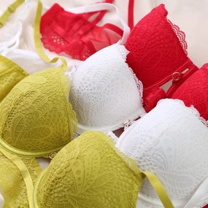 Detailed close-up of floral crochet lace texture on elegant underwire bras in various colors
